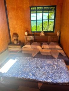 Postel nebo postele na pokoji v ubytování Cabaña Vista Pinares San Ignacio Chalatenango