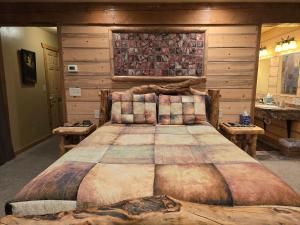 a bedroom with a large bed in a room at BuffaloPeaks Lodge in Buena Vista
