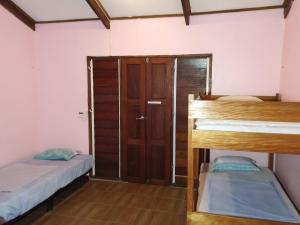 Postel nebo postele na pokoji v ubytování Bluepango Guest House