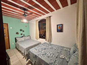 Postel nebo postele na pokoji v ubytování Pousada Casa de Buzios