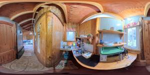 a small kitchen in a house with wooden walls at Cabaña Don Agustin in Hornopiren