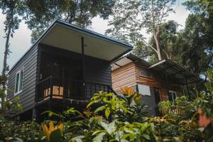 a small house with a large window on the side of it at My Home Koh Kood1 in Ko Kood