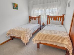 Postel nebo postele na pokoji v ubytování Tickety-Boo on Collopy