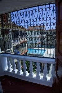 a balcony with a view of a swimming pool at Alpha Homes in Mombasa