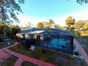 a rendering of a house with a blue roof at st pete pool house in St Petersburg