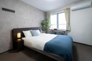 Giường trong phòng chung tại LudiCent717 - Vacation STAY 08147v