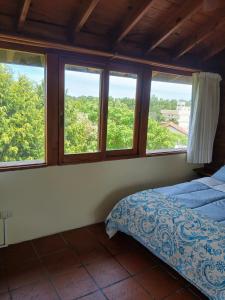 Ένα ή περισσότερα κρεβάτια σε δωμάτιο στο Apart Pampas de Gesell