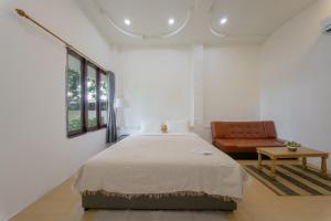 Postel nebo postele na pokoji v ubytování Three CoCo Villa AoNang Beach