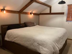 Ένα ή περισσότερα κρεβάτια σε δωμάτιο στο Chalet Tsugaike