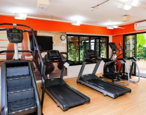 a gym with treadmills and elliptical machines at Apart Hotel Itaim Bibi in São Paulo