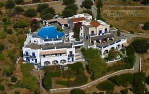 an aerial view of a house with a swimming pool at Lefkes Village in Lefkes