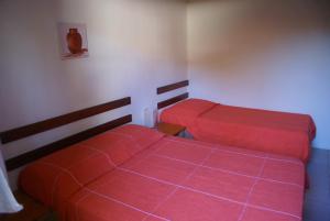 Una cama o camas en una habitación de Pousada A Cor Do Sol