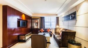 TV a/nebo společenská místnost v ubytování Centenio International Hotel