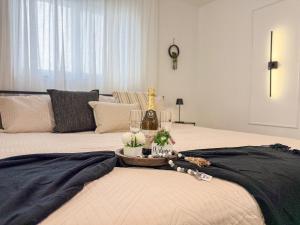 a bedroom with two beds and a table with wine glasses at King Comfort Suite Kitchen Wi-Fi Parking in Pembrook Pines