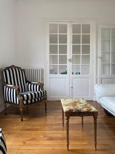 En eller flere senge i et værelse på Au coeur de l'Ile Saint Louis