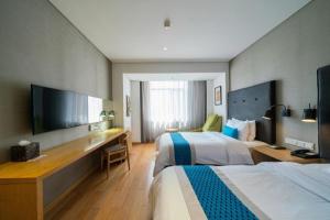 TV a/nebo společenská místnost v ubytování Yitel Shenyang Sanhao Street Shengjing Hospital