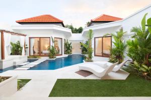 a villa with a swimming pool and a house at Villa Mia Seminyak - Boutique Villas - I in Seminyak