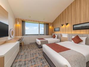 TV a/nebo společenská místnost v ubytování Izumigo Kiyosato Kogen Hotel + 21 fotografií