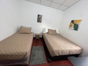 En eller flere senge i et værelse på Casa Lucía