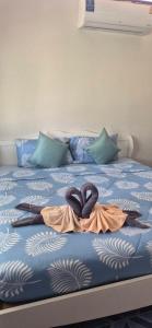 a bed with two hearts on top of it at Kohmook cocobeach in Ko Mook