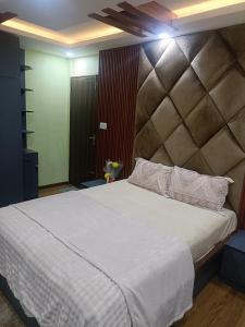 Ένα ή περισσότερα κρεβάτια σε δωμάτιο στο Le Petit Paradis Népal