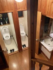 a bathroom with two toilets and a sink at Forest View Guesthouse in Omachi +35 photos