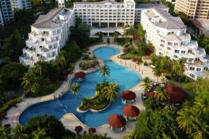 an aerial view of a pool at a resort at Sanya Summer Beach Sea View Hotel in Sanya