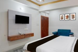 TV a/nebo společenská místnost v ubytování Collection O Digha Ghat Formerly Hotel Shahnai + 23 fotografií