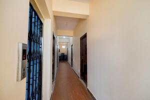 a hallway of a house with a door and a hallwayngth at Super Hotel O Bharat Institute of Engineering Hyderabad Formerly Blue Petals in Hyderabad