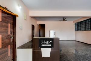 a room with a counter with a sign on it at Super Hotel O Bharat Institute of Engineering Hyderabad Formerly Blue Petals in Hyderabad