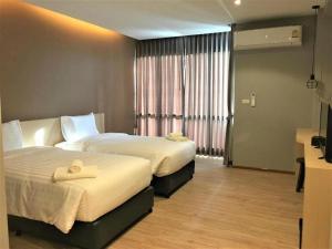 Postel nebo postele na pokoji v ubytování Sans Hotel + 182 fotografií