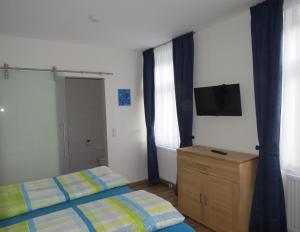 Ein Bett oder Betten in einem Zimmer der Unterkunft Gasthof Christine Enne