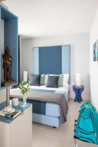 A bed or beds in a room at Villa Gervasio Rooms