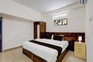 Ένα ή περισσότερα κρεβάτια σε δωμάτιο στο Super Collection O Mappedu Chennai Formerly Nitas Business Hotel +23 φωτογραφίες