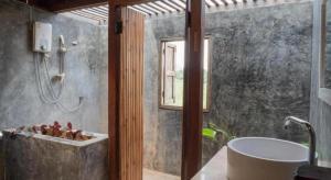 a bathroom with a tub and a sink and a shower at The Frog Khao Yai Resort in Ban Tha Chang +37 photos