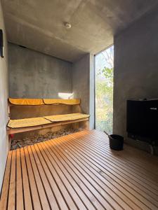 a room with a bed and a flat screen tv at TIMeSCAPE -hakone- in Miyanoshita