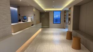 a lobby of a building with a window in it at JI Hotel Shanghai Stadium in Shanghai
