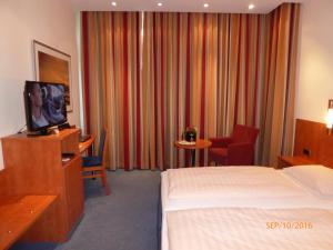 
Ein Bett oder Betten in einem Zimmer der Unterkunft Astoria Hotel
