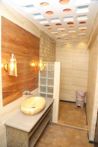 a bathroom with a sink on a counter at The Loft -Aadhya Homestay Hampi in Munirābād +26 photos