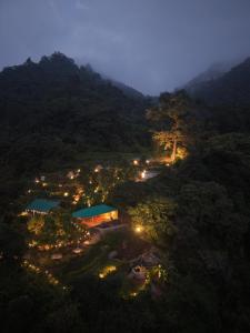 an aerial view of a town in the mountains at night at Neerville Waterfall Glamping- Neer waterfall in Shivpuri