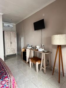 Μια τηλεόραση ή/και κέντρο ψυχαγωγίας στο VnS Beachfront Guesthouse +39 φωτογραφίες