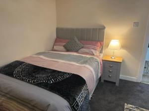 Postel nebo postele na pokoji v ubytování Avon View Suites