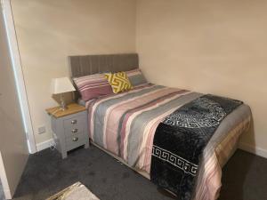 Postel nebo postele na pokoji v ubytování Avon View Suites