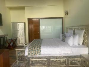 Ένα ή περισσότερα κρεβάτια σε δωμάτιο στο Amantran Resorts and Wellness Centre