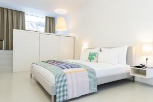 Postel nebo postele na pokoji v ubytování Greulich Design & Boutique Hotel