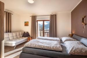 Кровать или кровати в номере Ferienwohnung Haus Germania