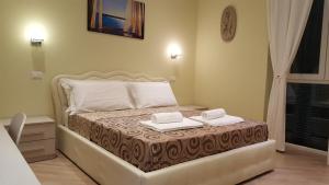 Postel nebo postele na pokoji v ubytování Guest House Le Tre Spezie