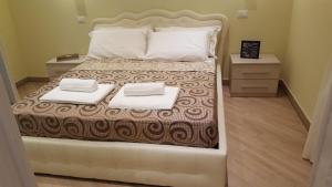 Postel nebo postele na pokoji v ubytování Guest House Le Tre Spezie