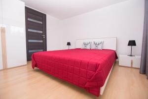 Posteľ alebo postele v izbe v ubytovaní Apartament Zacisze Tatr