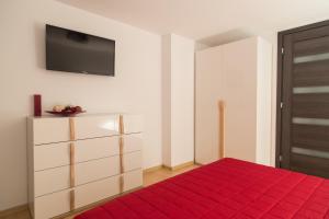 Posteľ alebo postele v izbe v ubytovaní Apartament Zacisze Tatr